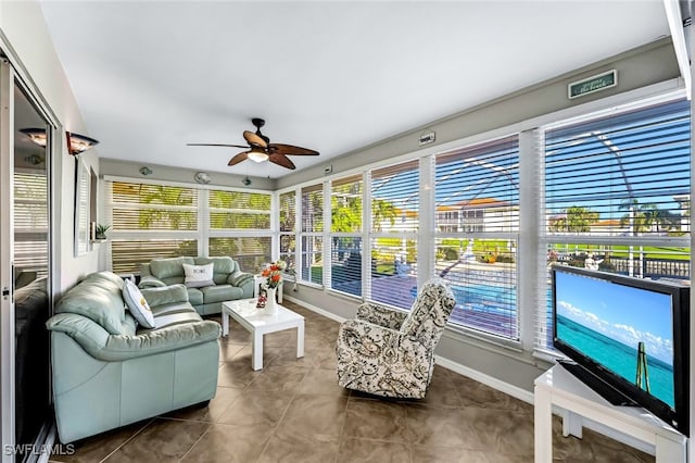 sunroom / solarium with ceiling fan