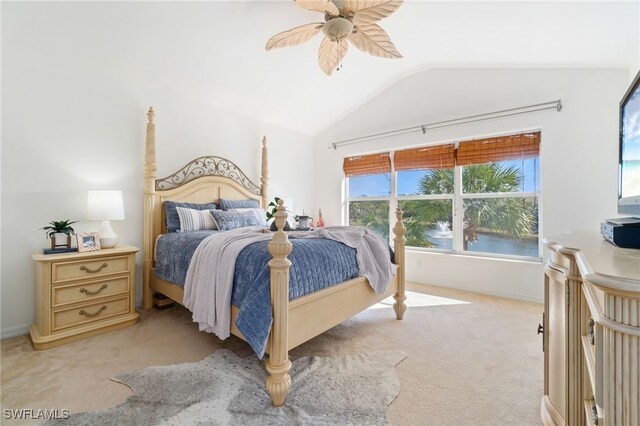 carpeted bedroom featuring ceiling fan and lofted ceiling