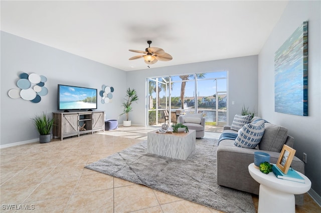 tiled living room featuring ceiling fan