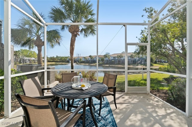 sunroom / solarium with a water view