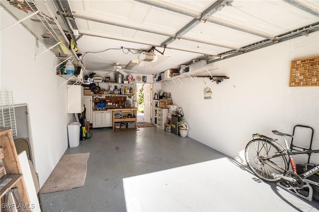 garage featuring a workshop area and a garage door opener