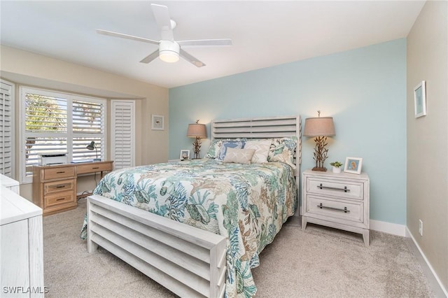 bedroom with ceiling fan and light carpet