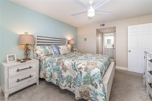 carpeted bedroom featuring ceiling fan and connected bathroom