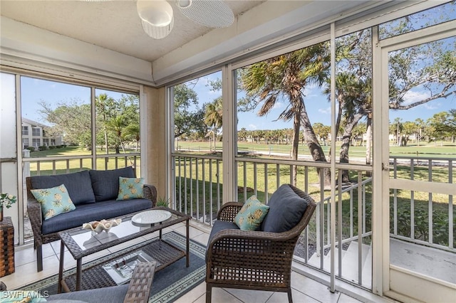 sunroom / solarium with ceiling fan