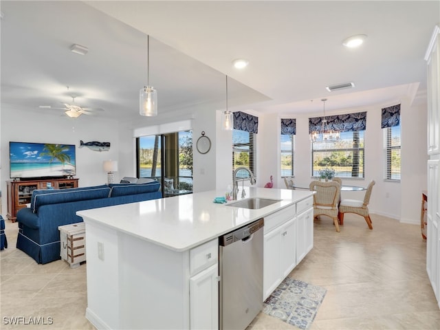 kitchen with white cabinets, sink, decorative light fixtures, dishwasher, and an island with sink