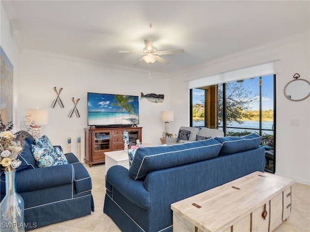 tiled living room with ceiling fan and ornamental molding