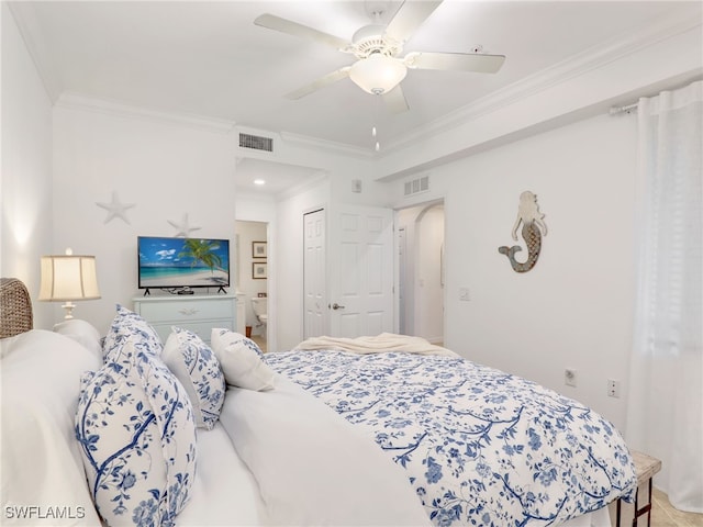 bedroom featuring ceiling fan, ornamental molding, and a closet