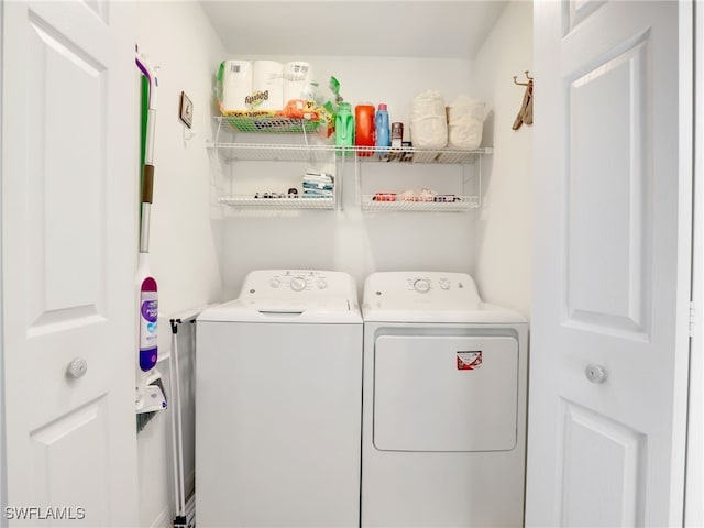 clothes washing area with independent washer and dryer