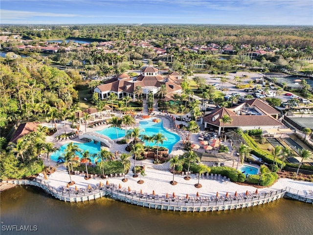 birds eye view of property with a water view