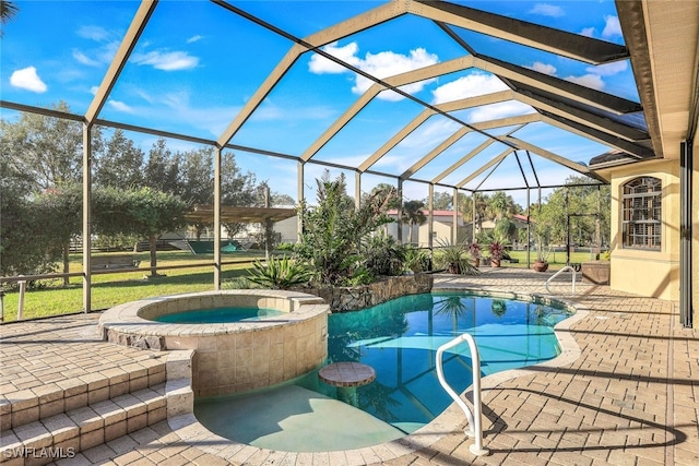 view of swimming pool featuring a lanai, an in ground hot tub, and a patio