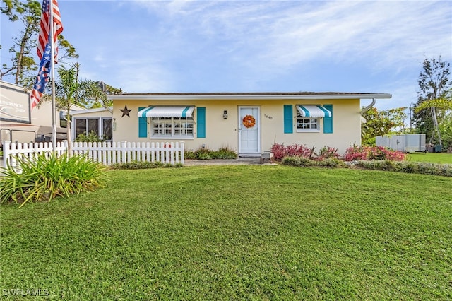 single story home with a front lawn