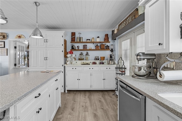 kitchen featuring stainless steel dishwasher, pendant lighting, white cabinetry, and light hardwood / wood-style floors