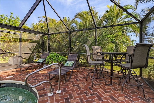 view of patio / terrace featuring a lanai