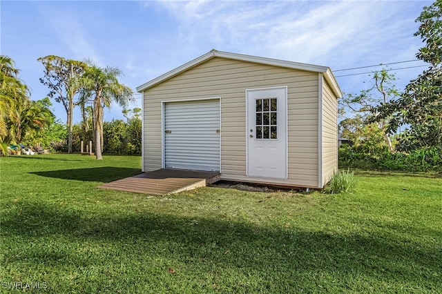 view of outbuilding featuring a lawn