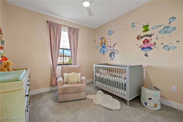 bedroom with carpet floors and a nursery area