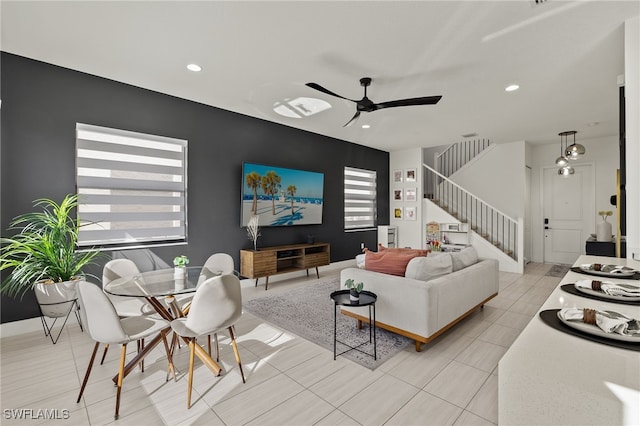 tiled living room featuring ceiling fan