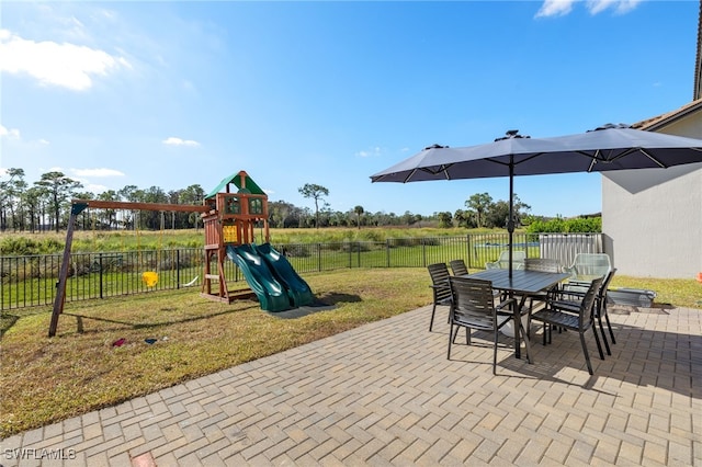 view of patio with a playground