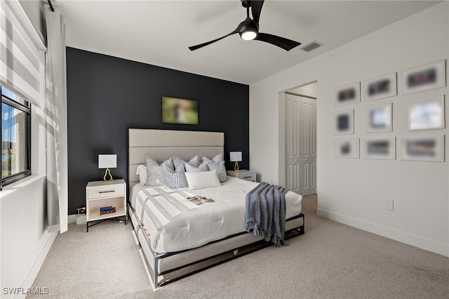 bedroom featuring carpet, a closet, and ceiling fan