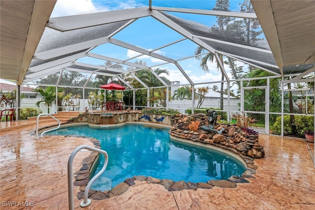 view of swimming pool with a lanai and a patio area