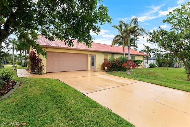 ranch-style house with a garage and a front yard