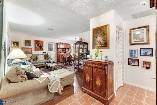 living room with a textured ceiling