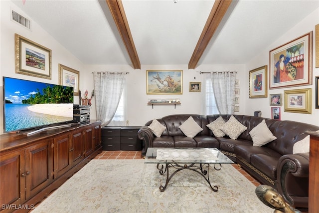 tiled living room featuring lofted ceiling with beams