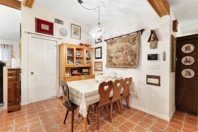 dining area featuring beam ceiling and a notable chandelier