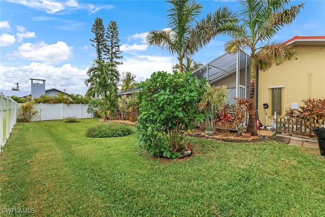 view of yard featuring a lanai