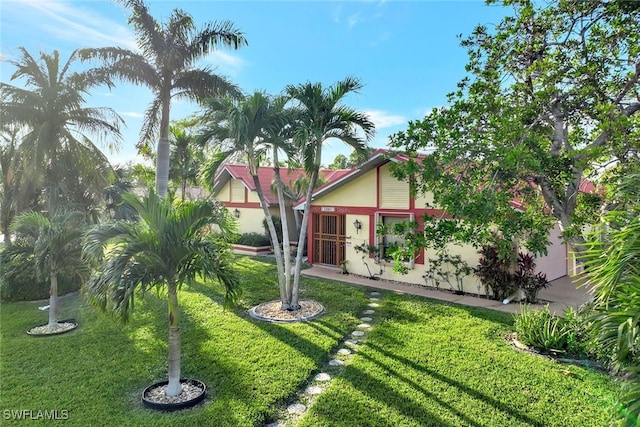 view of front of home with a front lawn