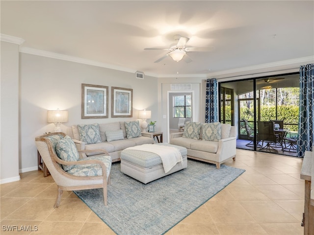 living room featuring ceiling fan, light tile patterned flooring, and crown molding