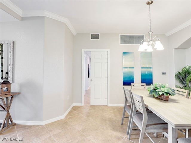 tiled dining room featuring crown molding and an inviting chandelier