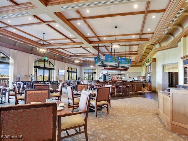 dining space with beam ceiling and coffered ceiling