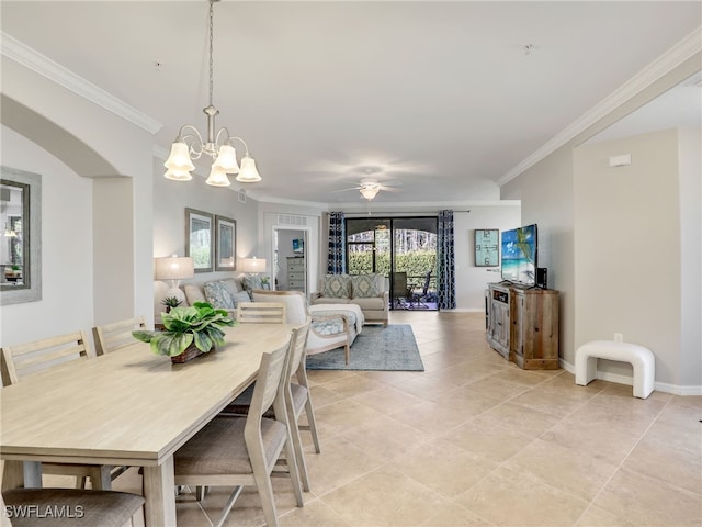 tiled dining space featuring crown molding and ceiling fan with notable chandelier