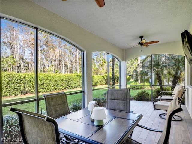 sunroom / solarium with ceiling fan