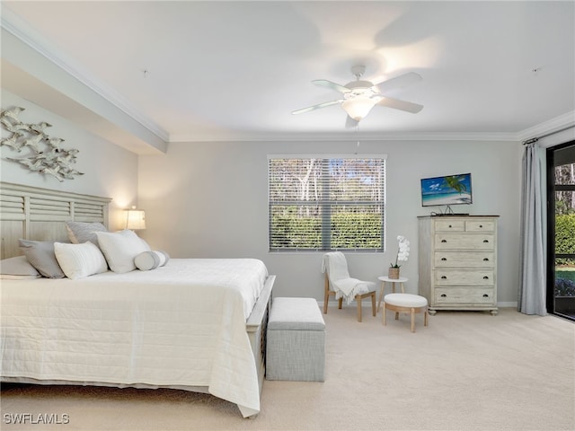 carpeted bedroom with ceiling fan and ornamental molding