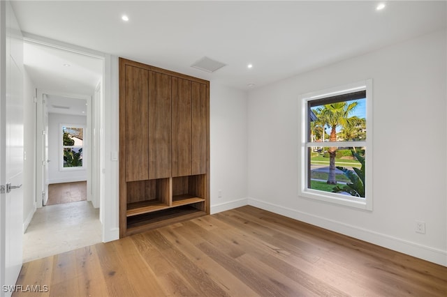 unfurnished bedroom featuring light wood-type flooring