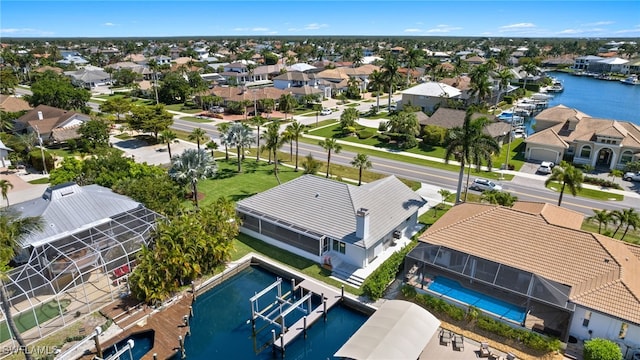 birds eye view of property with a water view