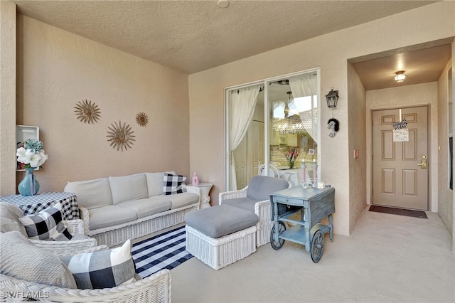 living room with a textured ceiling