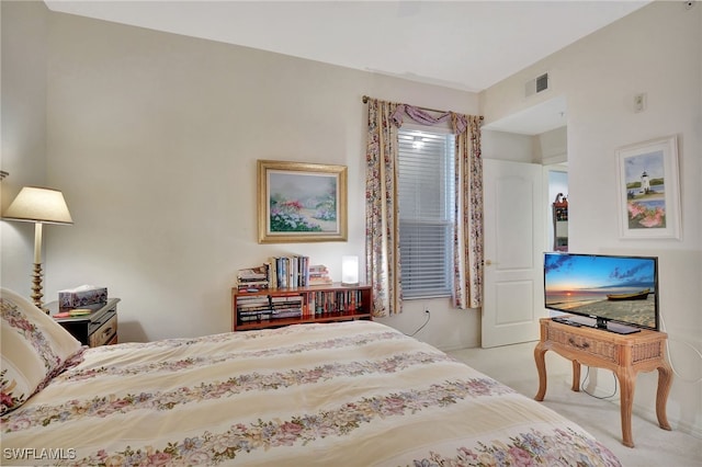 bedroom featuring light carpet