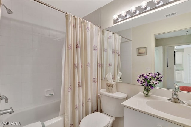 full bathroom featuring vanity, toilet, and shower / bath combo with shower curtain