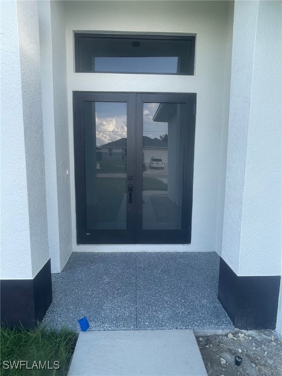 doorway to property featuring french doors