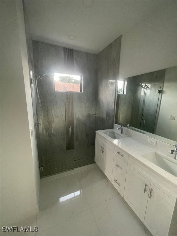 bathroom with vanity and an enclosed shower