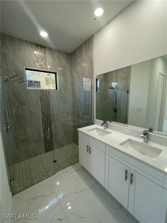 bathroom with walk in shower and vanity