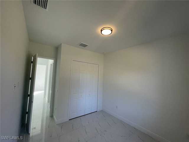 unfurnished bedroom featuring a closet