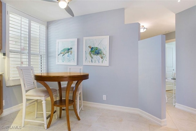 dining area featuring ceiling fan and light tile patterned flooring