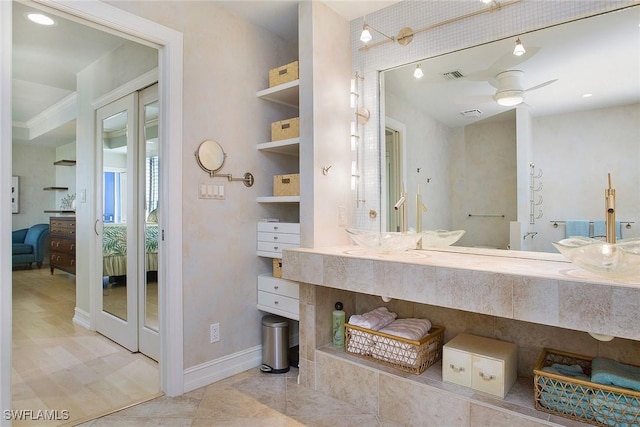 bathroom featuring vanity, built in features, and ceiling fan