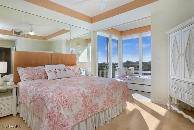 bedroom with ceiling fan, light hardwood / wood-style floors, ornamental molding, and access to outside