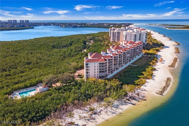 bird's eye view featuring a water view and a beach view