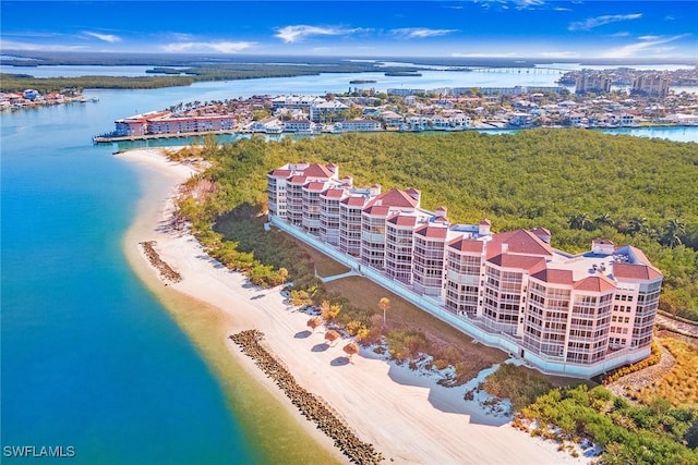 drone / aerial view featuring a view of the beach and a water view