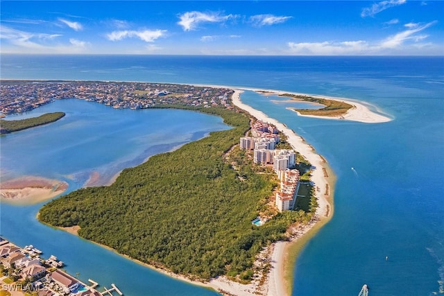 drone / aerial view with a beach view and a water view